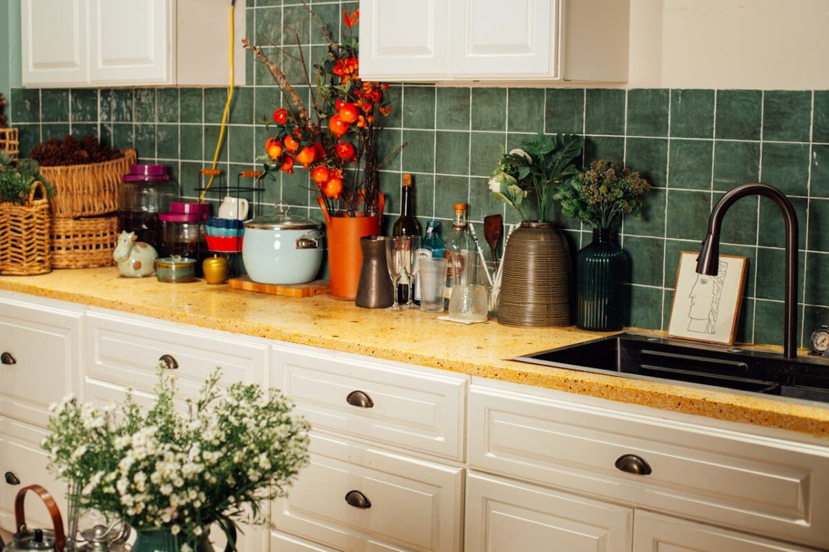 Services Inviting kitchen scene featuring decorative items and plants on a countertop for a warm, homely atmosphere.